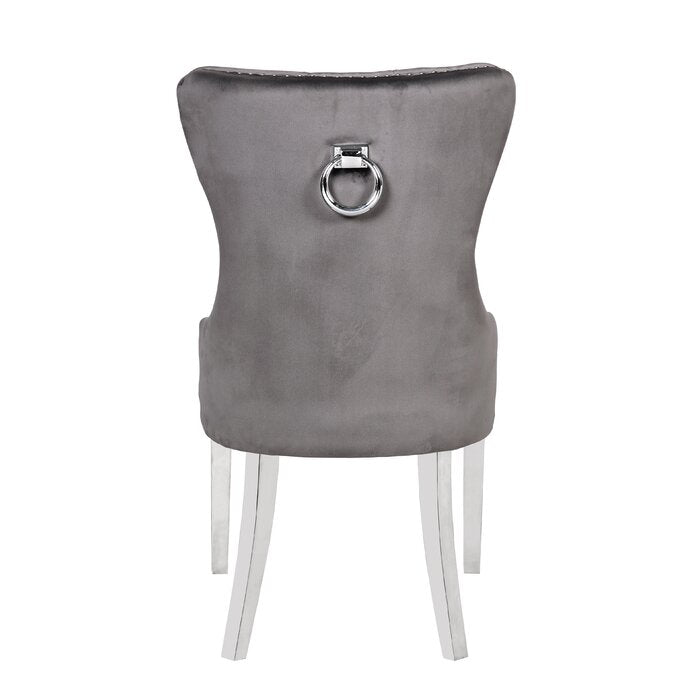 Elegant grey velvet dining chair with silver ring pull and polished chrome legs