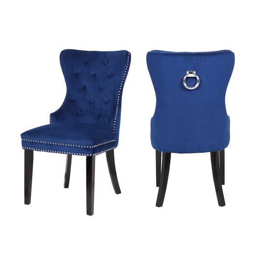 Deep blue velvet dining chair with tufted back and silver nailhead trim