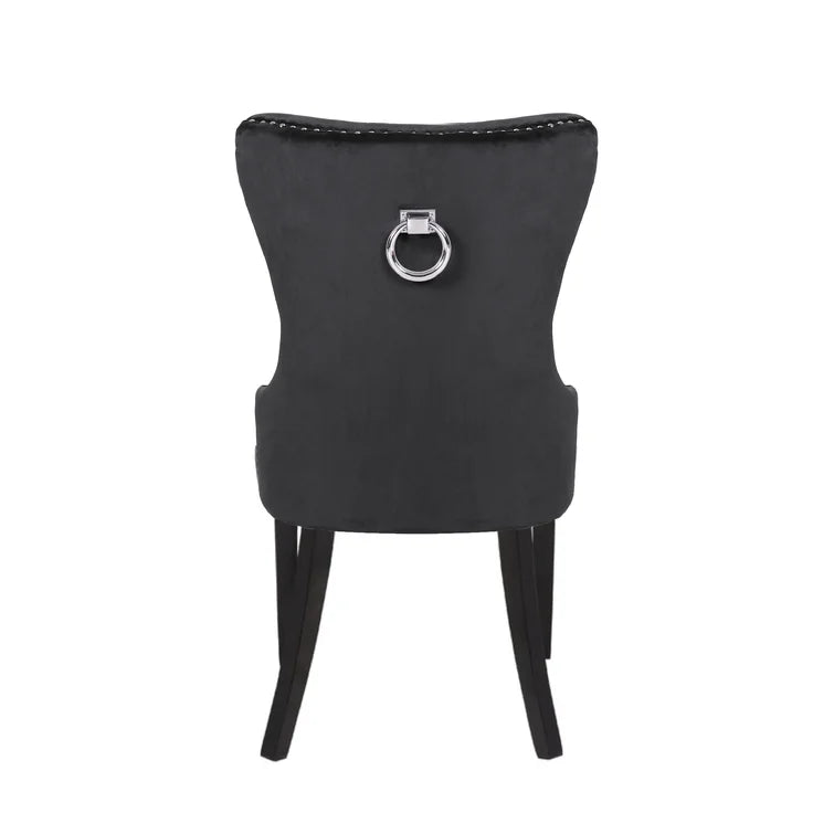 Black velvet dining chair with silver ring pull and stud detailing
