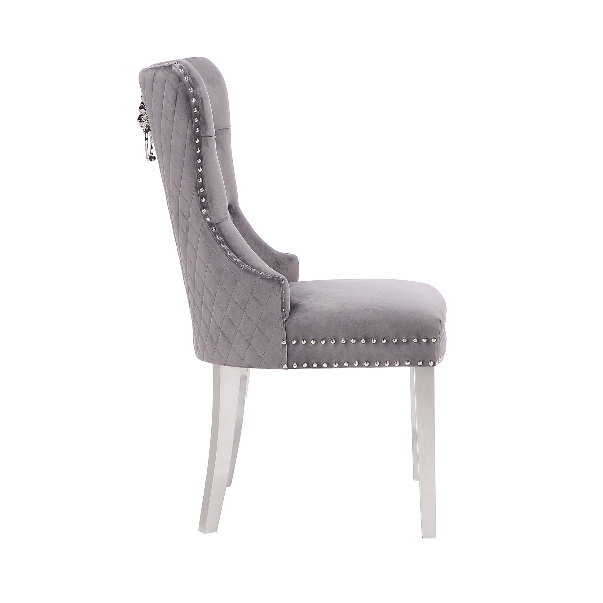 Elegant gray velvet dining chair with diamond tufting and silver nailhead trim