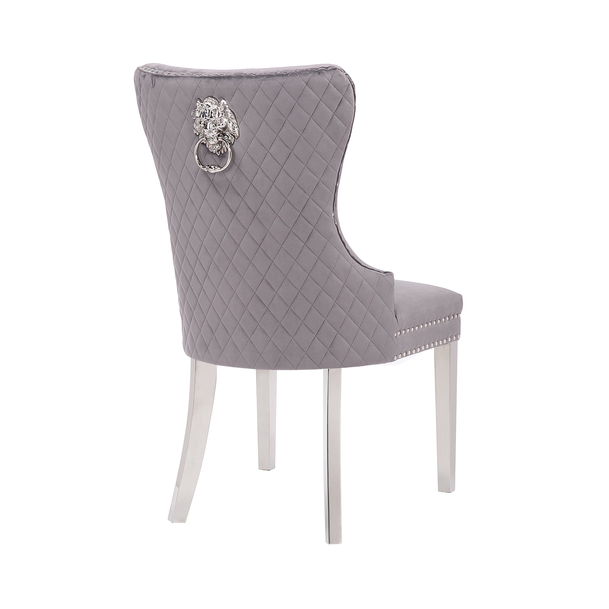 Quilted grey velvet dining chair with lion head ring and silver legs accent piece
