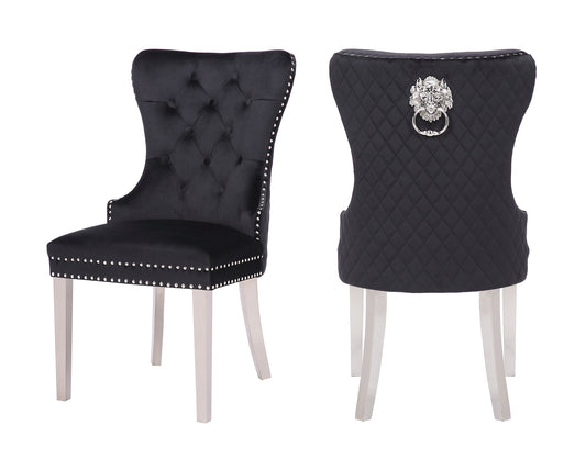 Black velvet dining chair with tufted back and silver nailhead trim