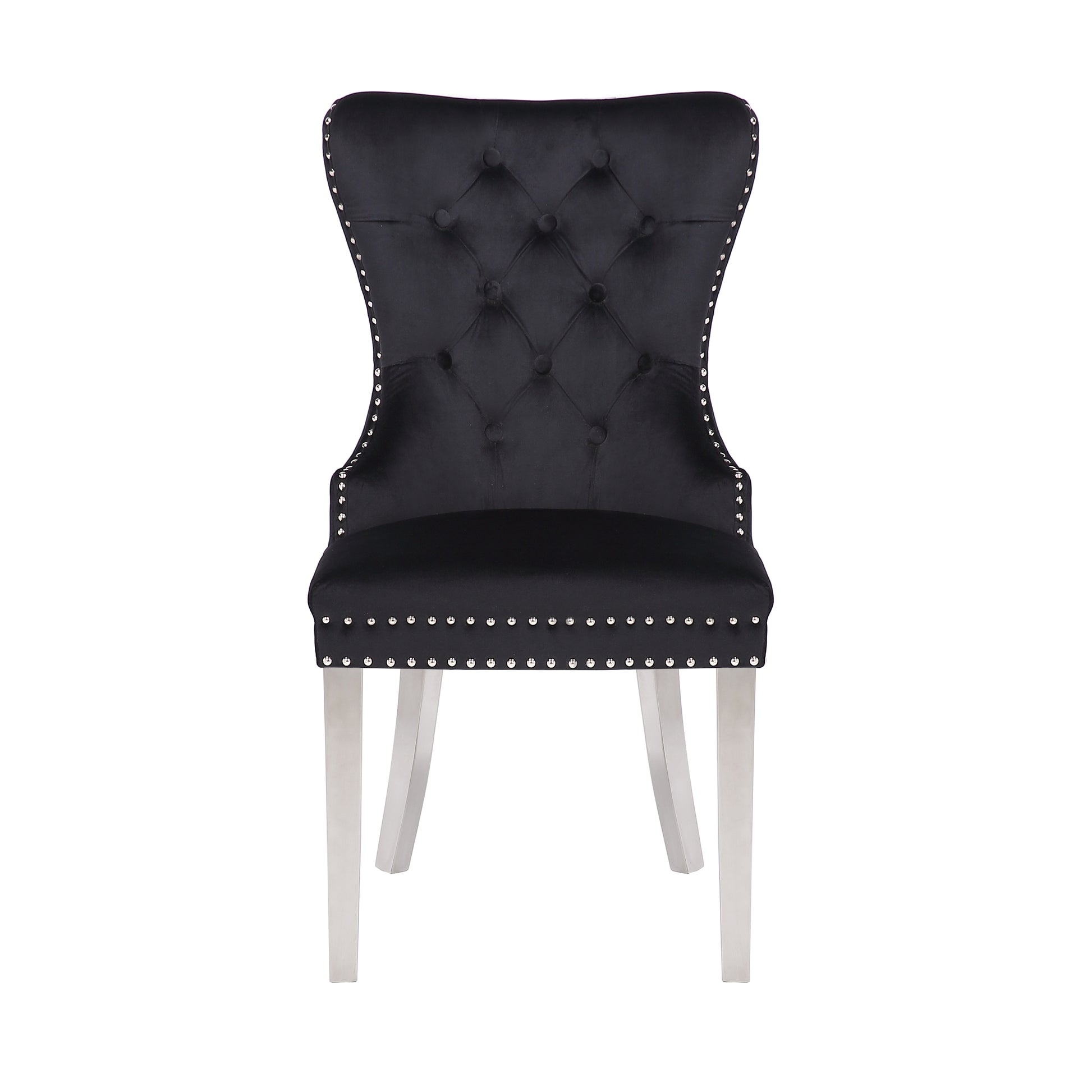 Black velvet tufted dining chair with silver nailhead trim and sleek metal legs