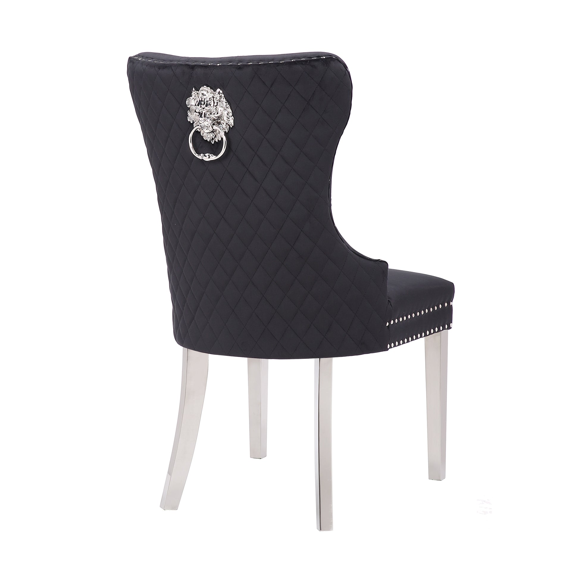 Black velvet dining chair with diamond tufting and lion knocker