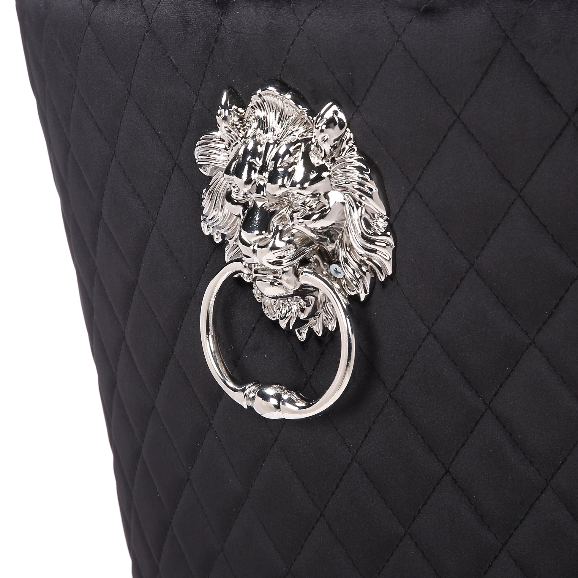Black quilted fabric armchair with a silver lion head knocker accent