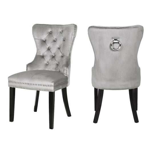 Tufted silver velvet dining chair with nailhead trim and dark wood legs