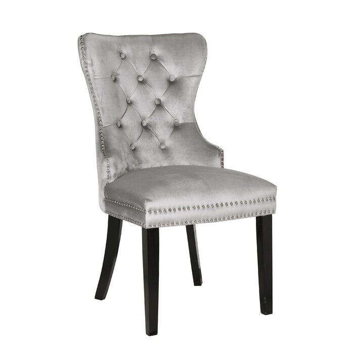 Silver velvet dining chair with diamond tufting and nailhead trim