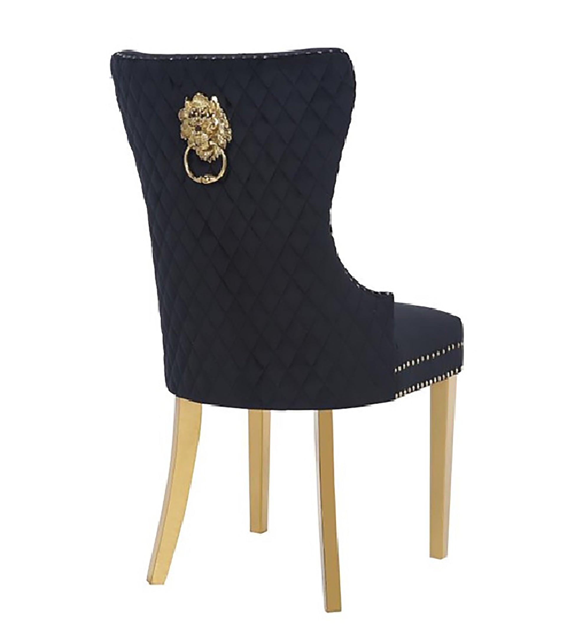 Black velvet dining chair with diamond tufting and gold lion knocker