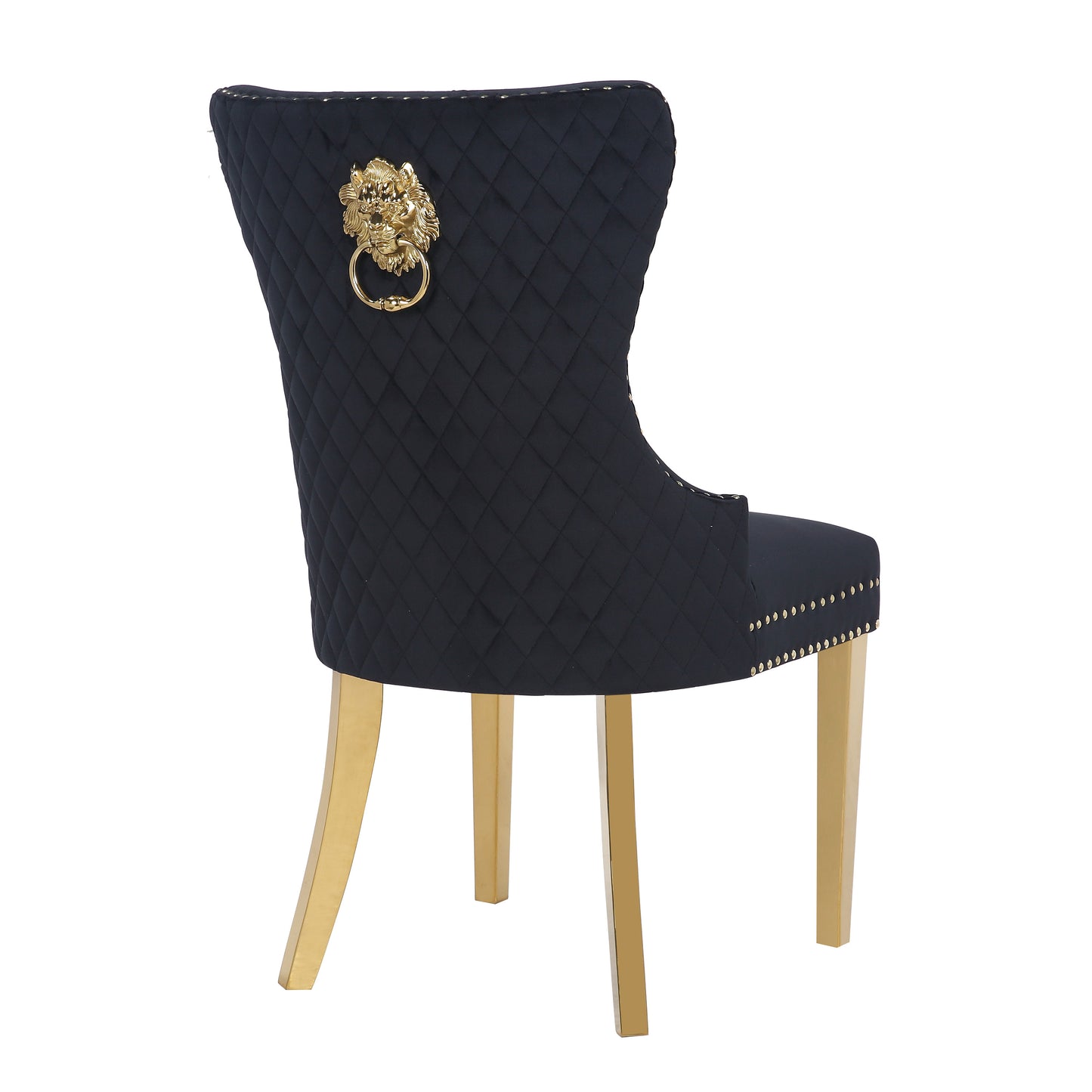 Black velvet dining chair with diamond tufting and gold lion knocker accent