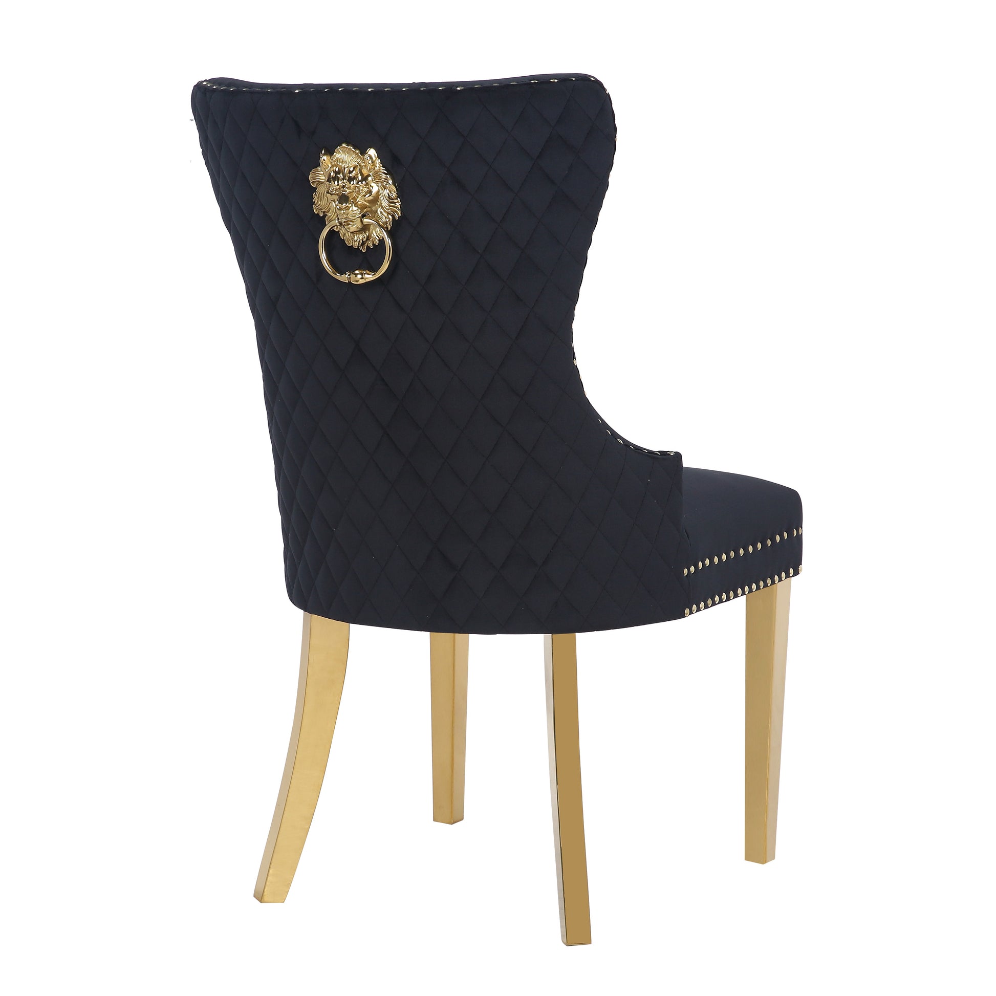 Black velvet dining chair with diamond tufting and gold lion knocker accent