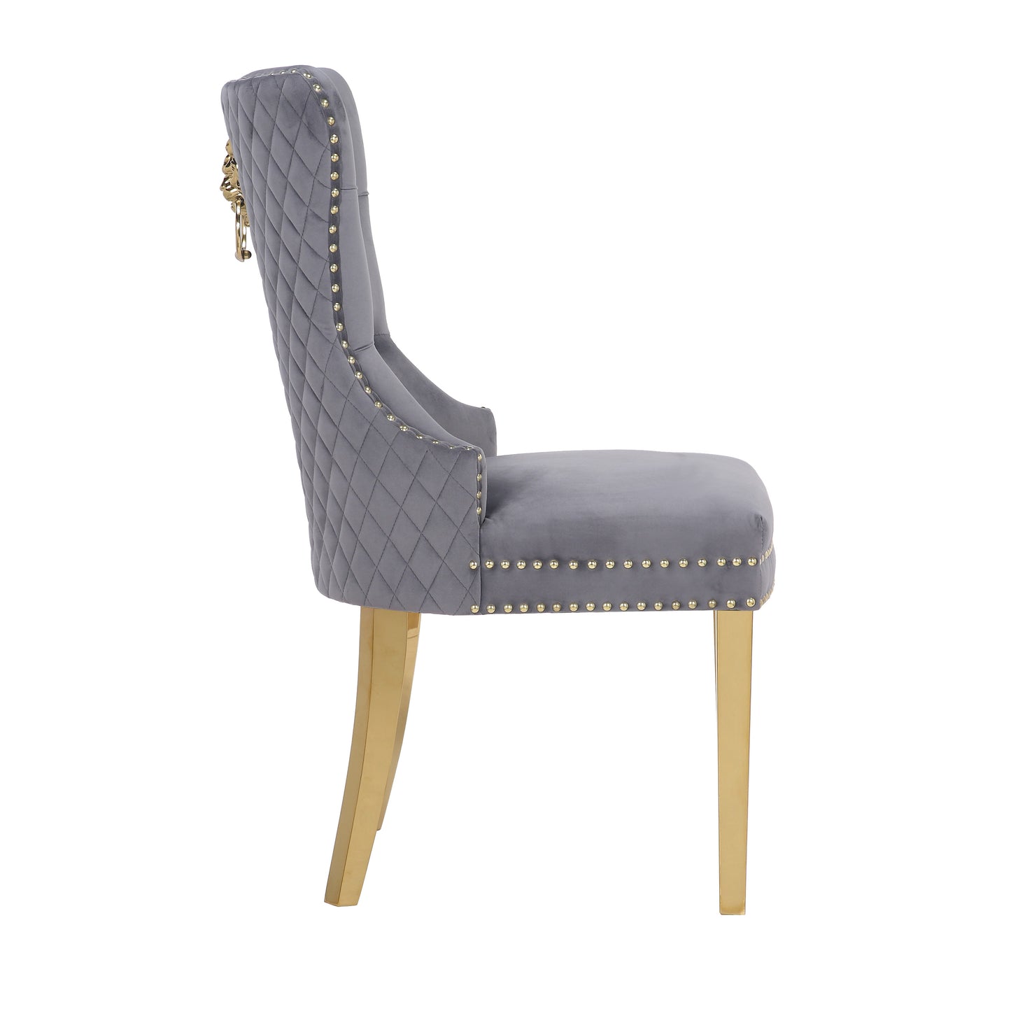 Grey velvet dining chair with gold studding and lion head accent
