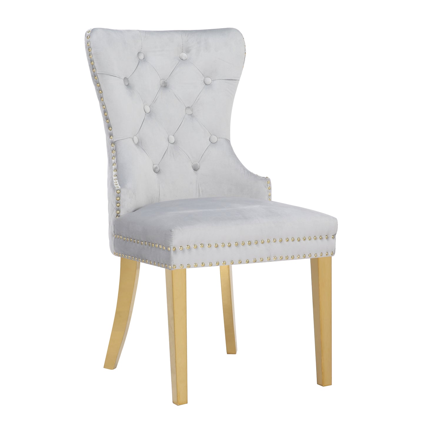 Grey velvet tufted dining chair with gold studded trim and brass legs