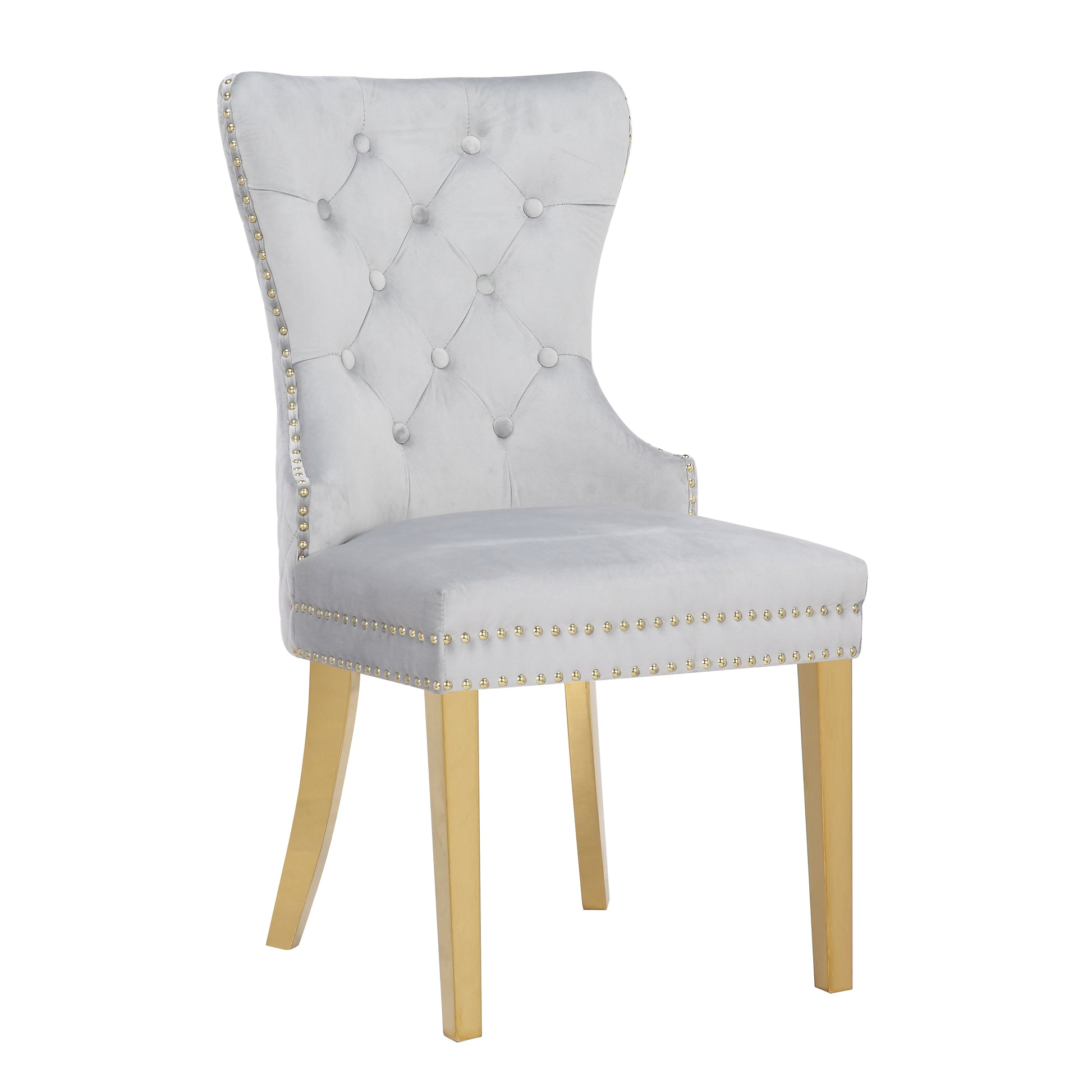 Grey velvet tufted dining chair with gold studded trim and brass legs