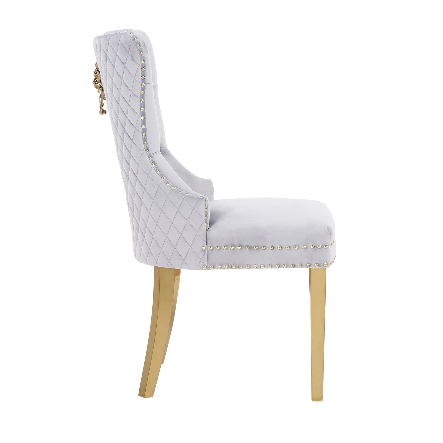 Light grey velvet accent chair with tufted back and gold lion head accent