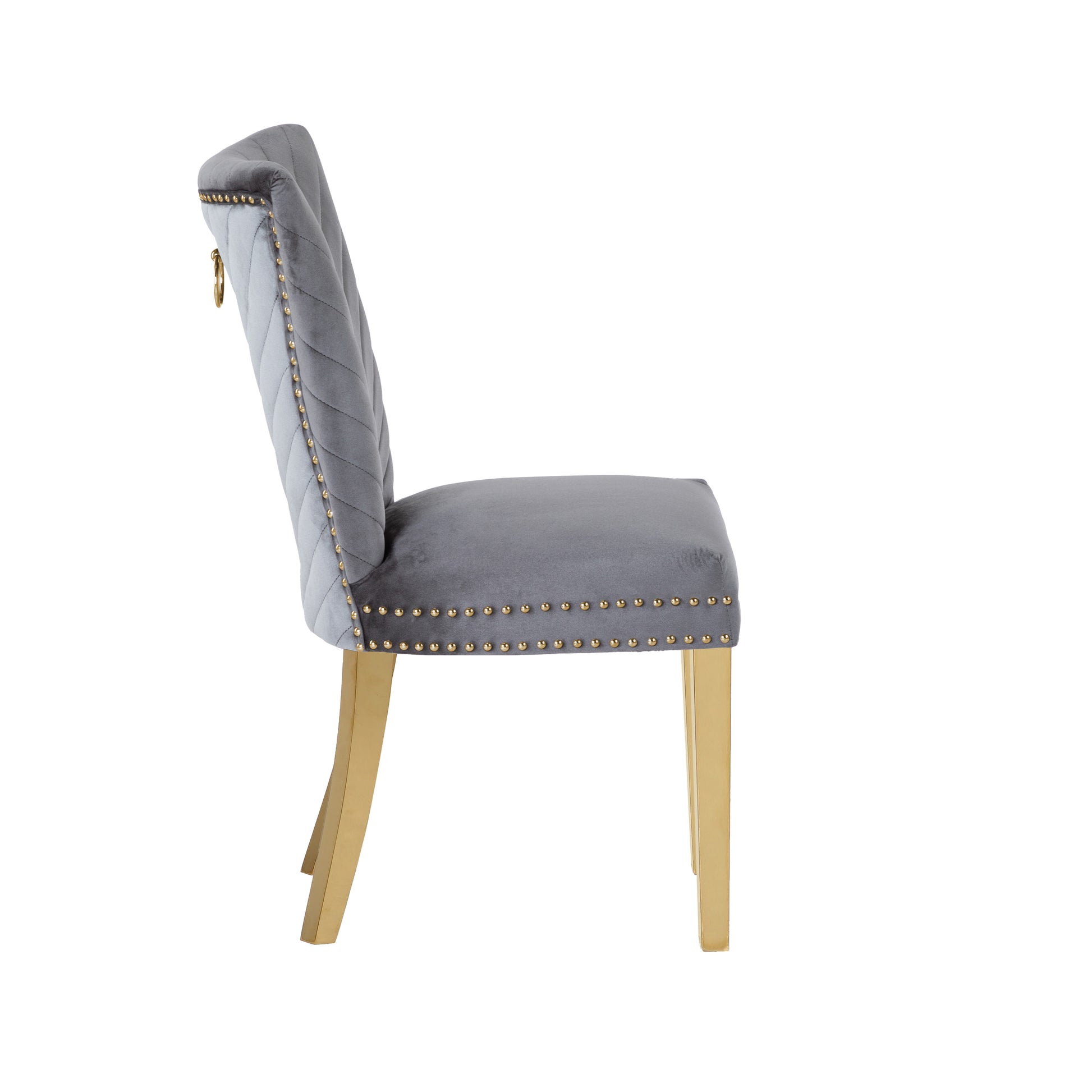 Elegant grey velvet dining chair with gold studded trim and modern brass legs