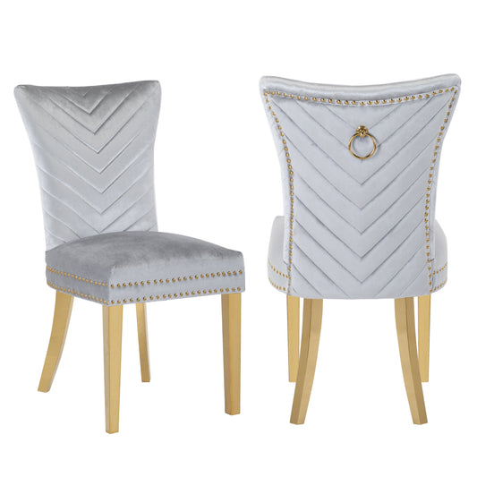 Light grey velvet dining chair with chevron back and gold legs