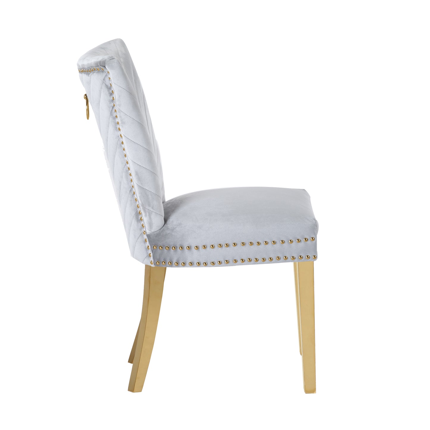 Light gray velvet dining chair with tufted back and gold legs