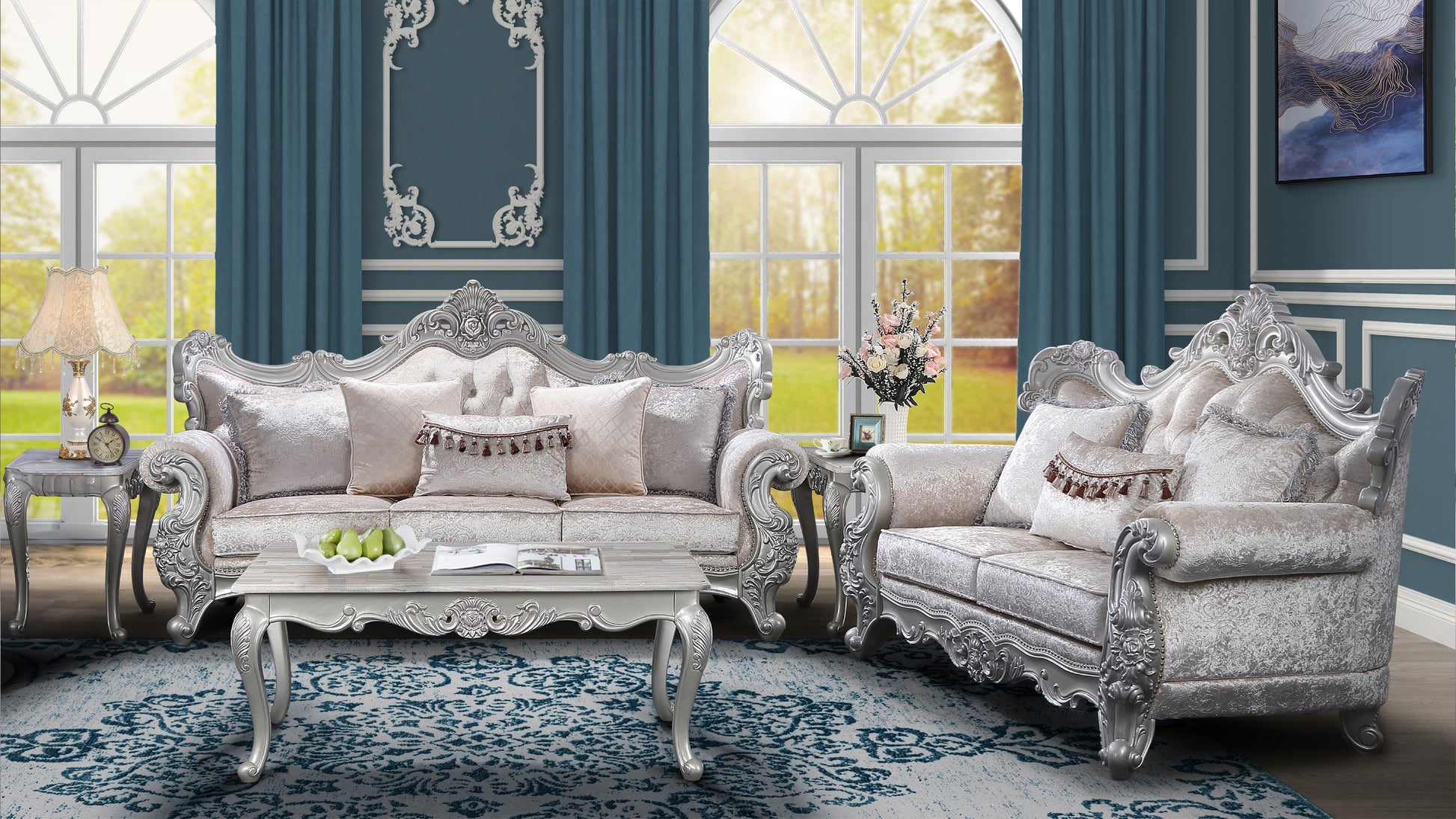 Luxurious silver carved sofa with plush velvet upholstery and ornate decorative pillows