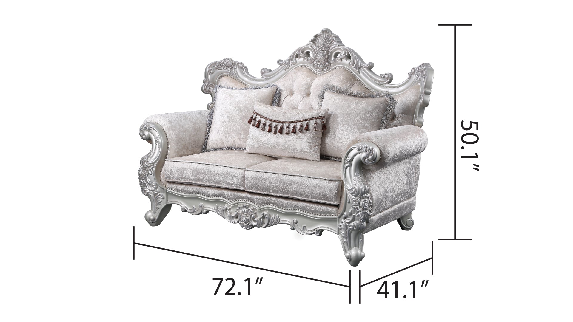 Ornate silver carved sofa with plush ivory velvet upholstery and decorative tassels