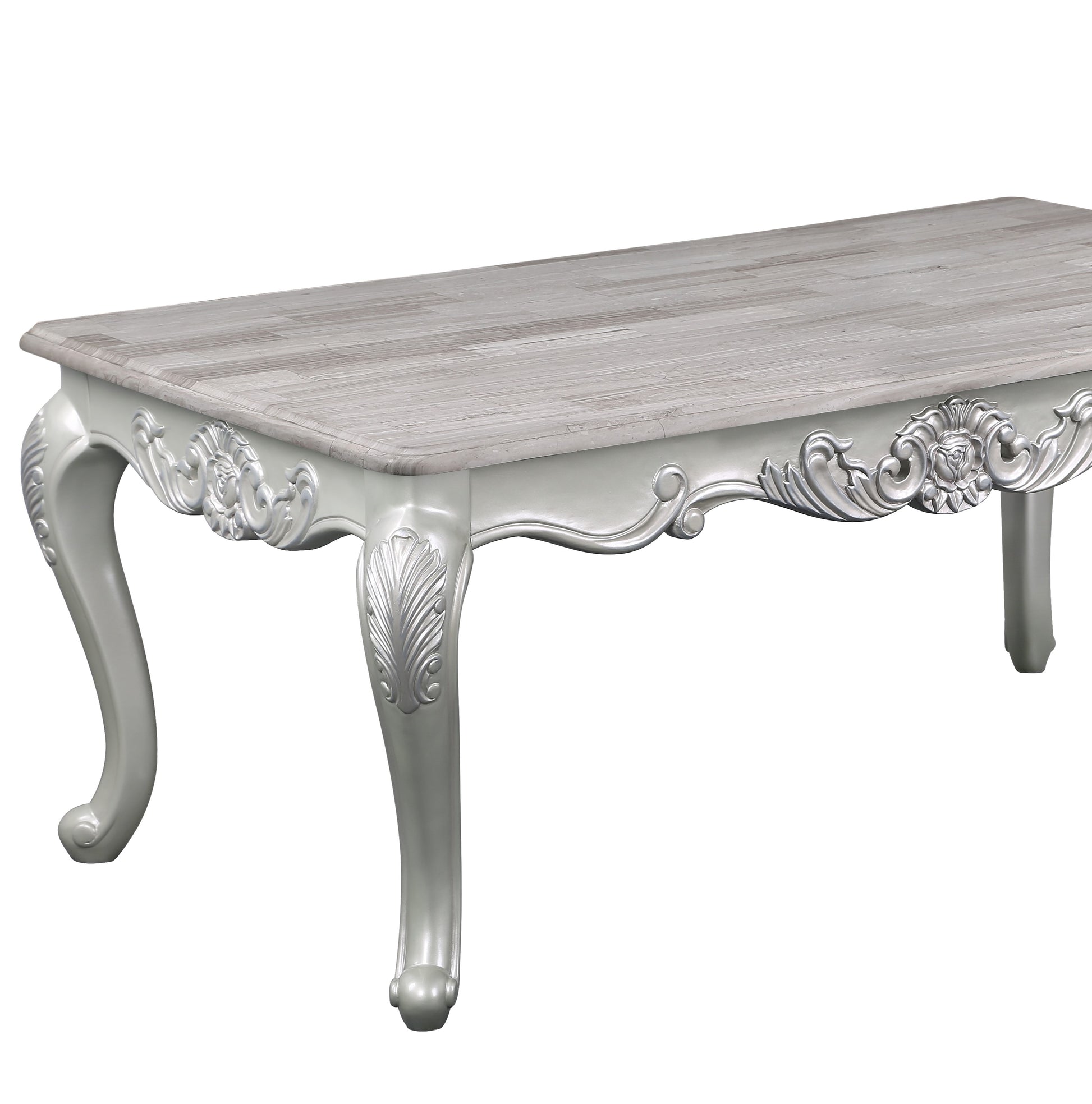 White baroque coffee table with ornate carved legs and woodgrain top