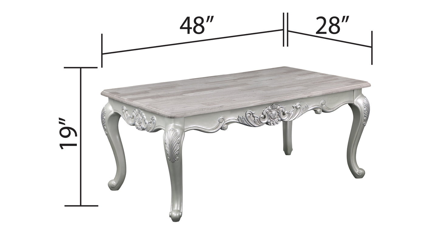 Ornate silver coffee table with textured wood top xx inches