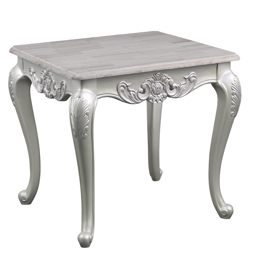 Ornate white accent table with carved legs and a woodlook top