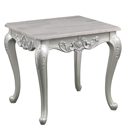 Ornate white accent table with carved legs and a woodlook top
