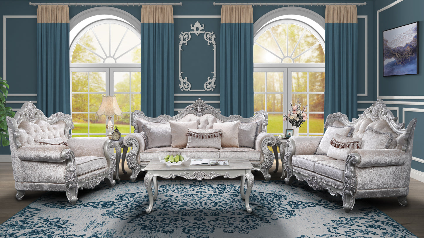 Ornate silver carved sofa set with plush beige upholstery perfect for a luxurious living room