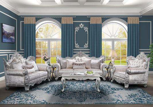 Luxurious silver carved sofa set with ornate detailing plush white upholstery and decorative pillows