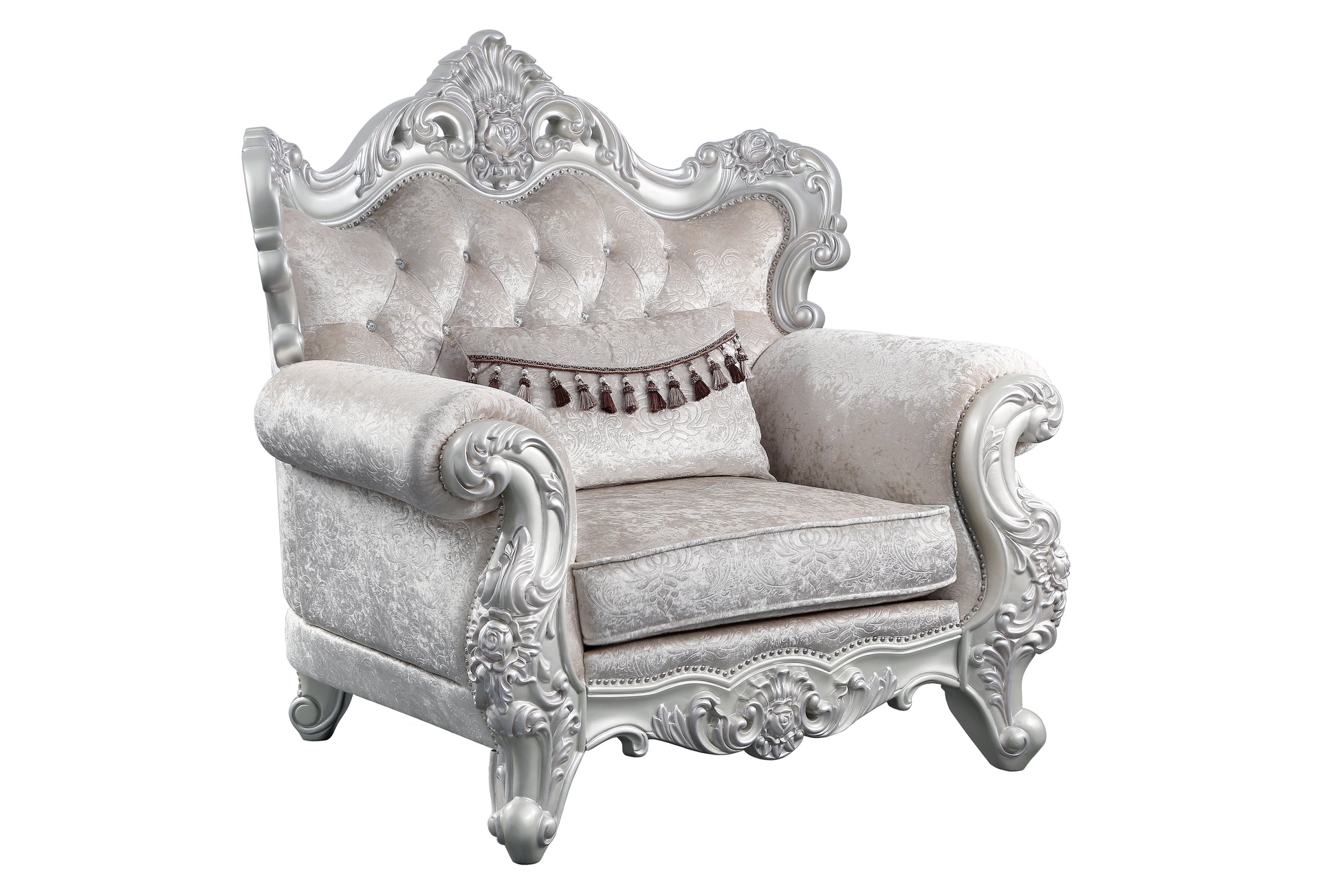 Ornate silver carved armchair with tufted beige damask upholstery and decorative tassels