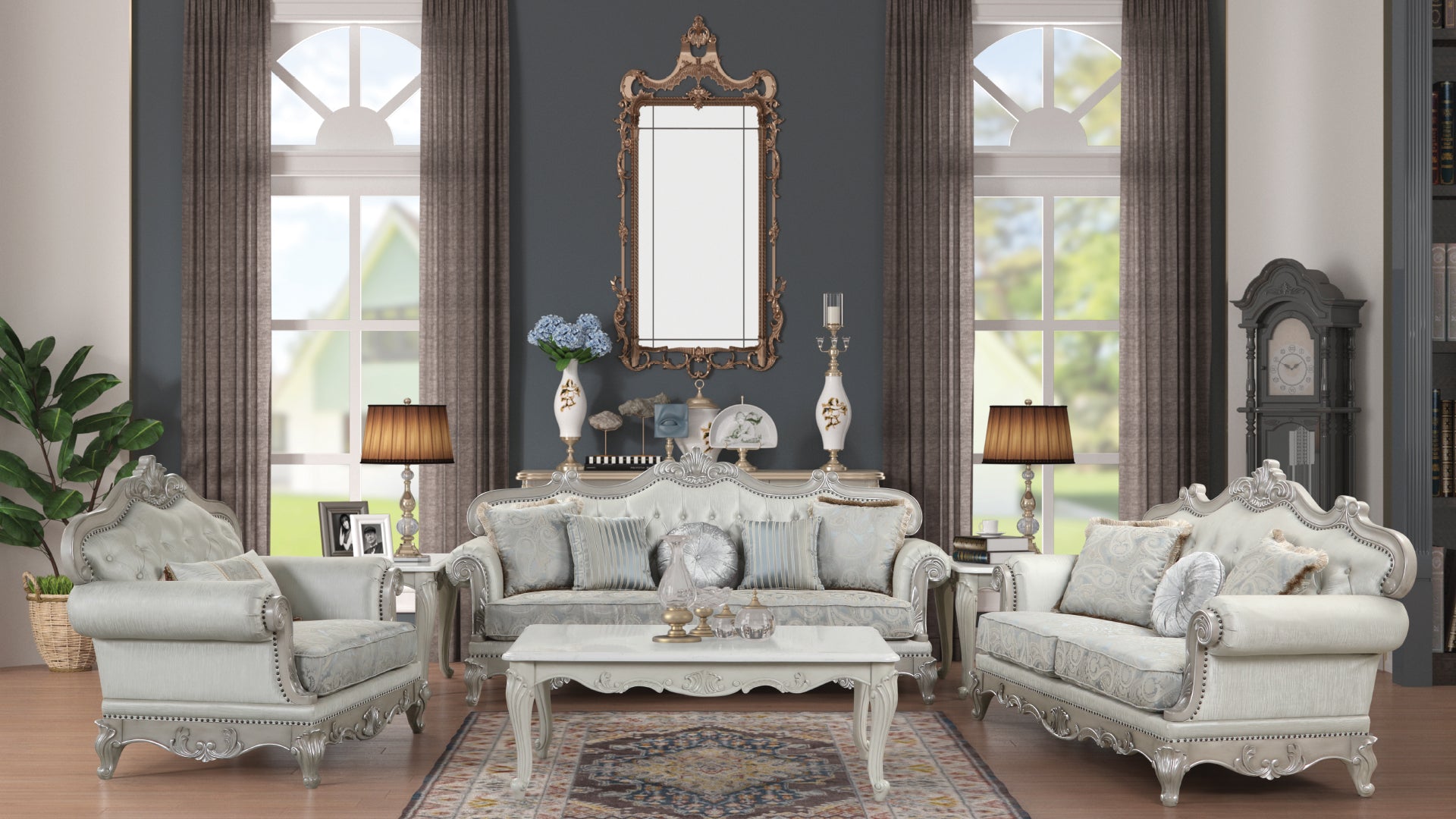 Ornate antique white sofa with ornate silver trim and plush throw pillows