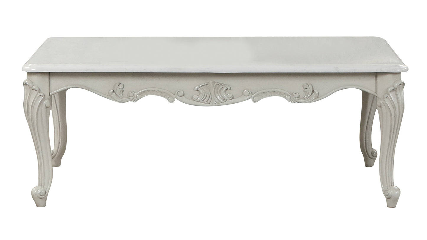 Ornate carved wooden coffee table with cabriole legs in antique white finish