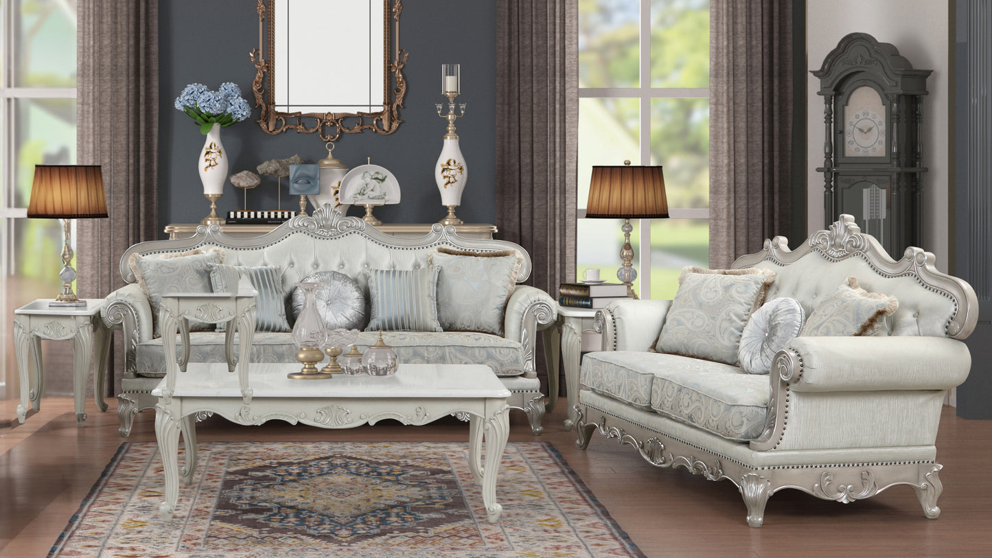 Opulent white ornate sofa with patterned fabric and decorative trim suitable for a formal living room