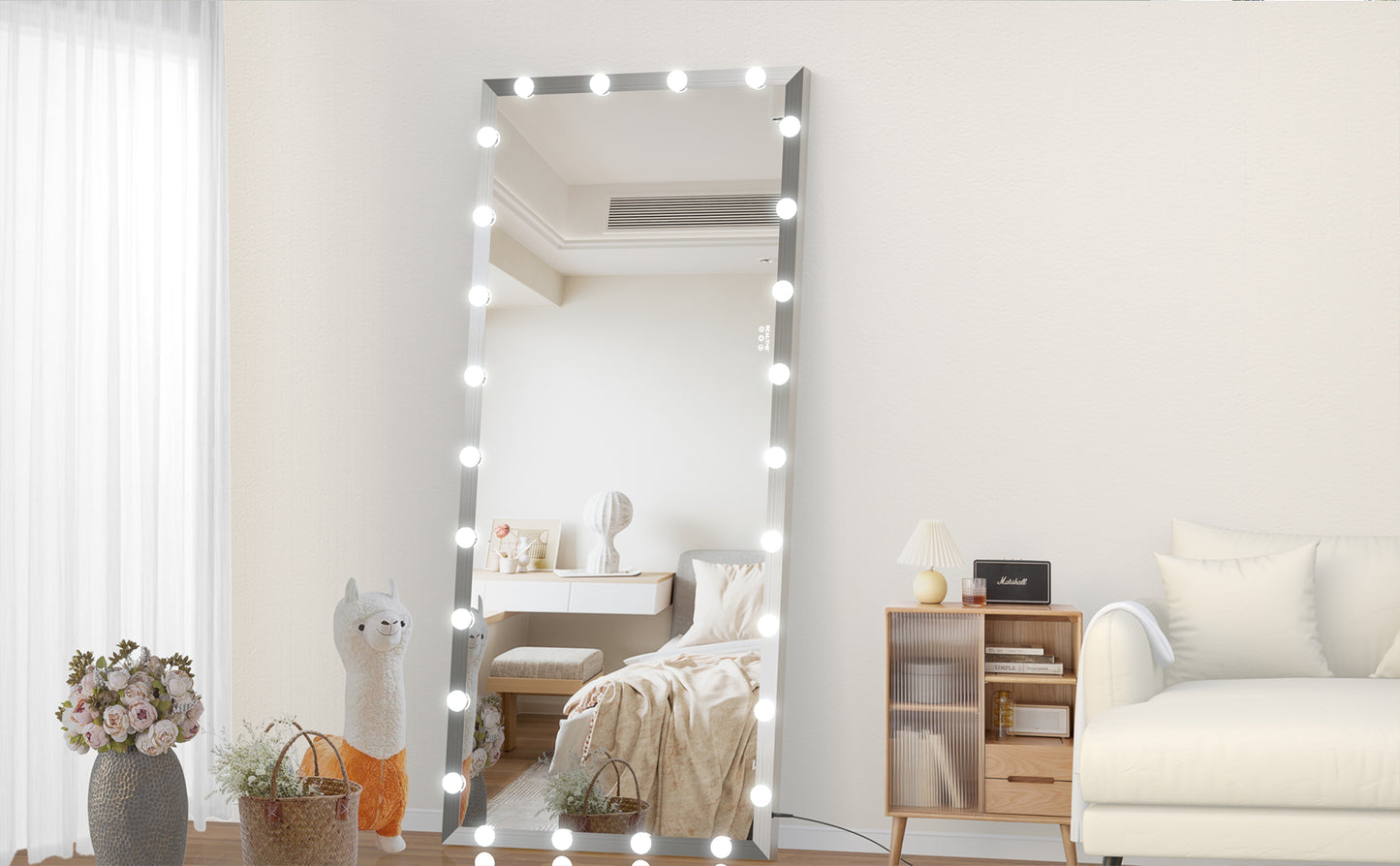 Fulllength standing mirror with Hollywoodstyle vanity lights and silver frame for makeup application