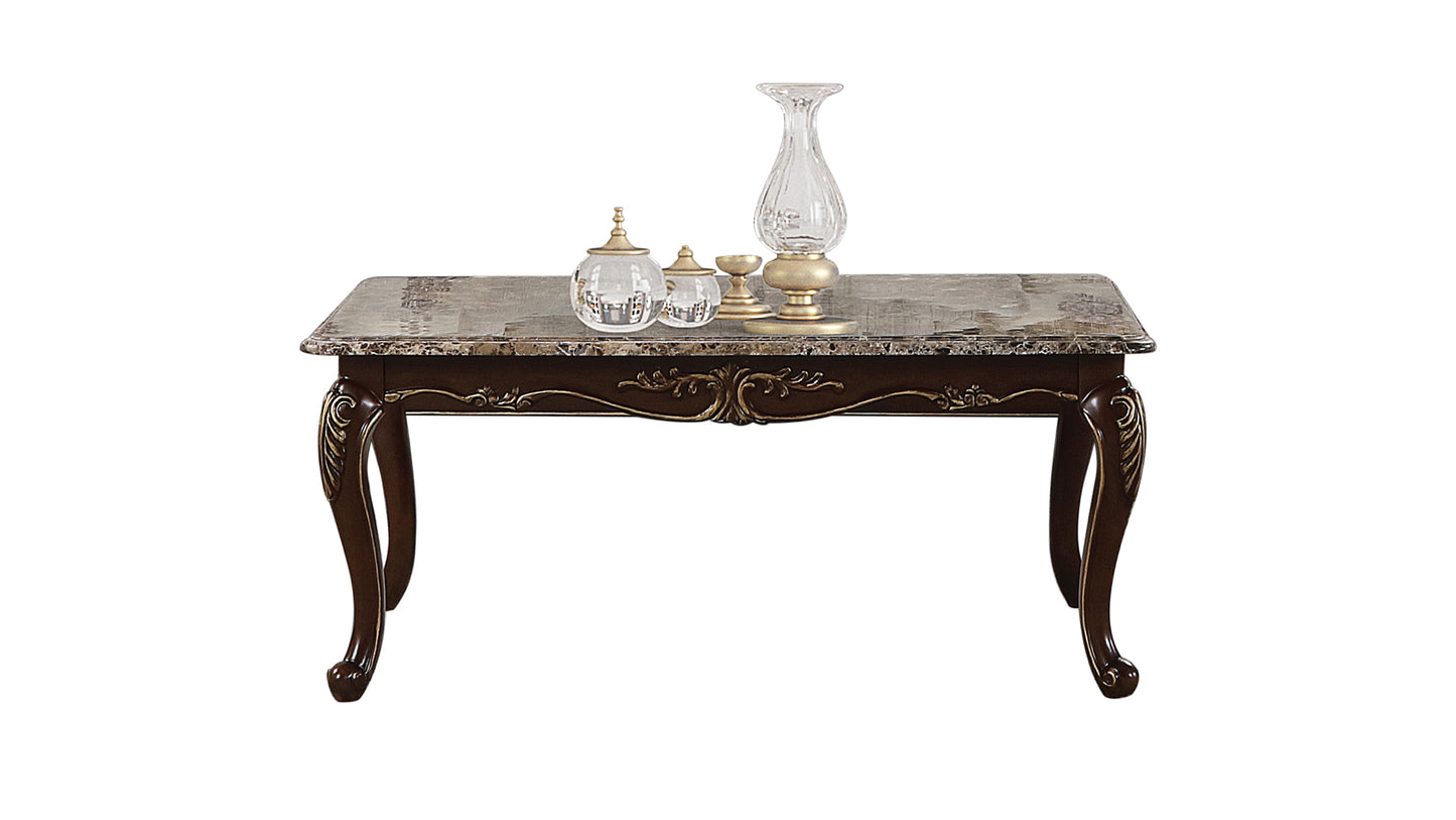 Ornate dark wood coffee table with marble top and decorative carved legs