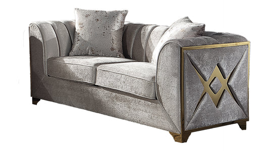 Elegant grey velvet sofa with golden geometric accents and plush cushions