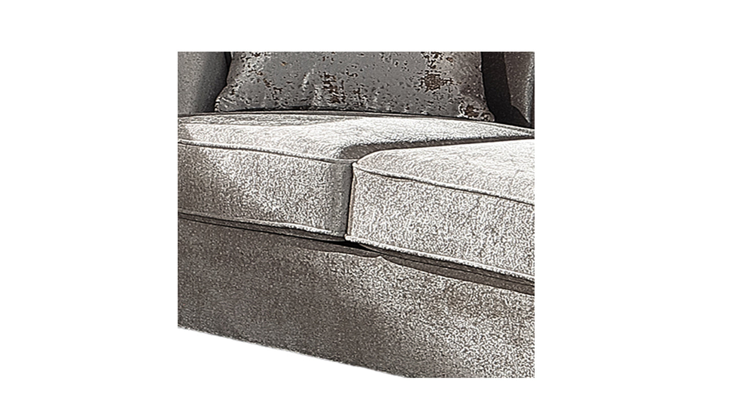 Close up of silver crushed velvet sofa cushions with a textured throw pillow