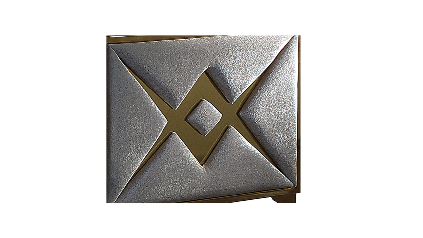 Silver embossed inlay with gold geometric accents on furniture panel