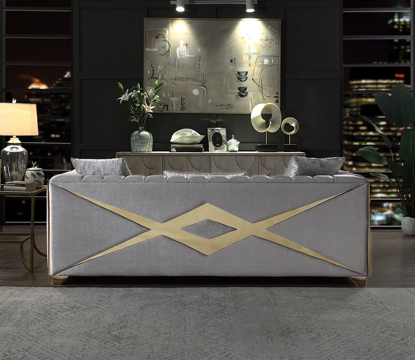 Elegant grey velvet sofa with gold geometric accents perfect for modern living rooms