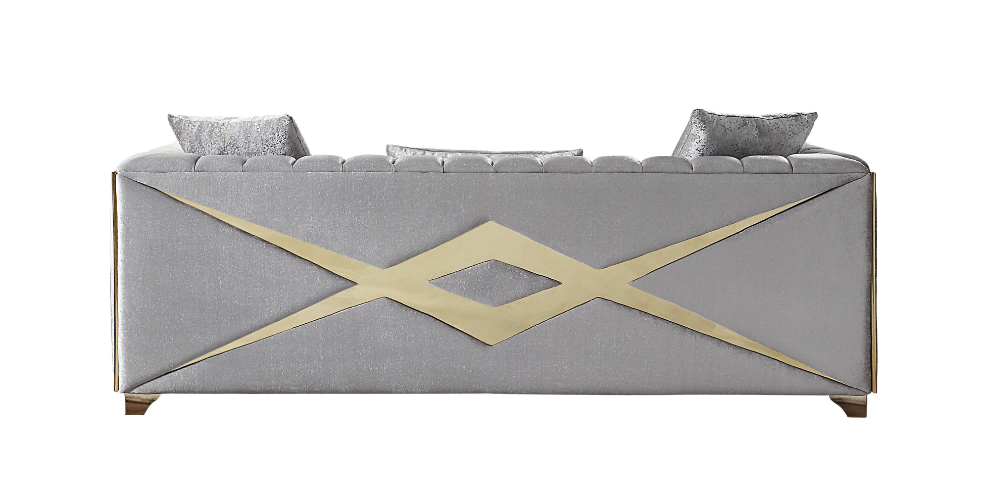 Grey upholstered sofa with tufted back and gold geometric accent