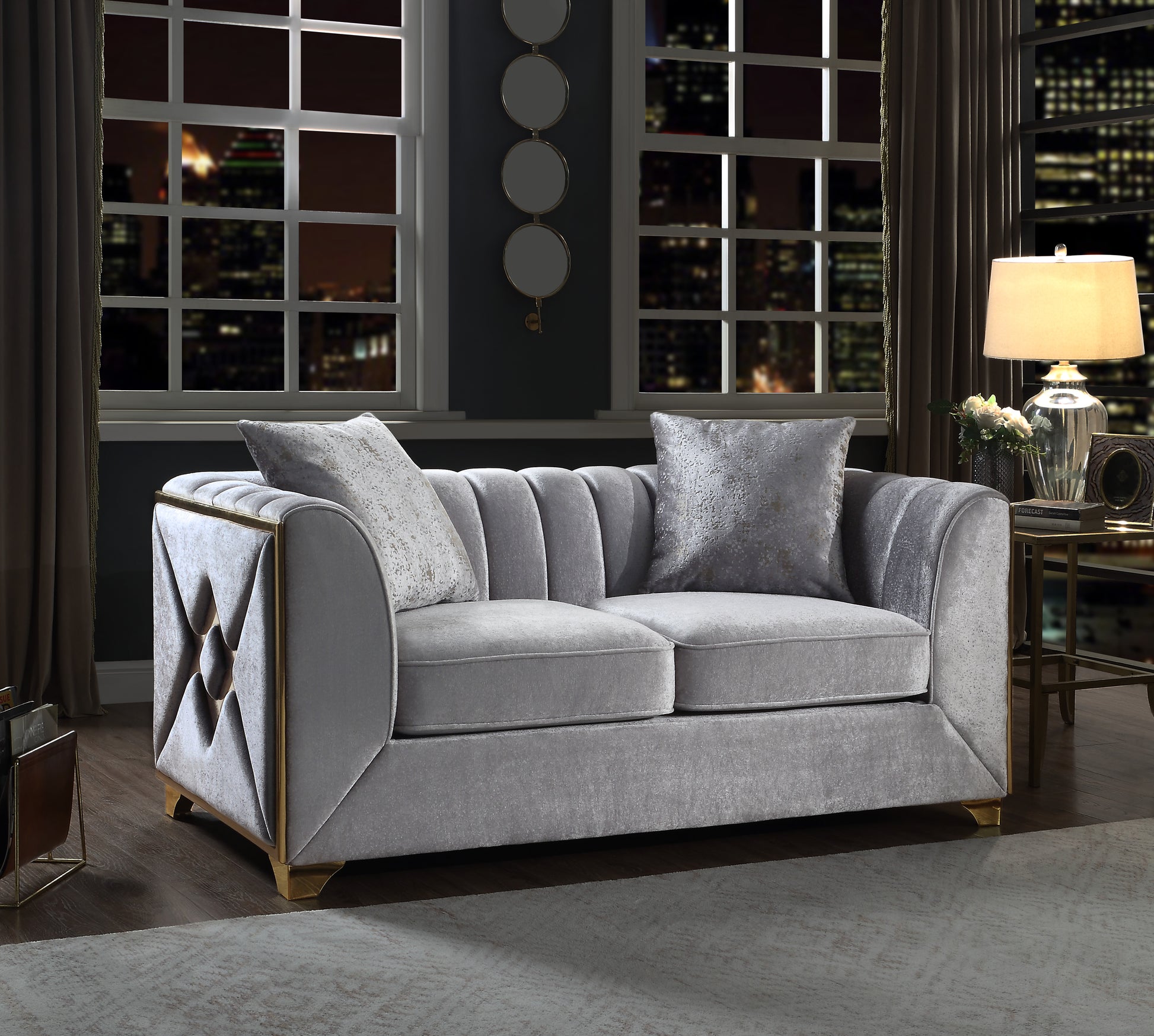 Luxurious grey velvet sofa with gold trim and channel tufting perfect for modern living rooms