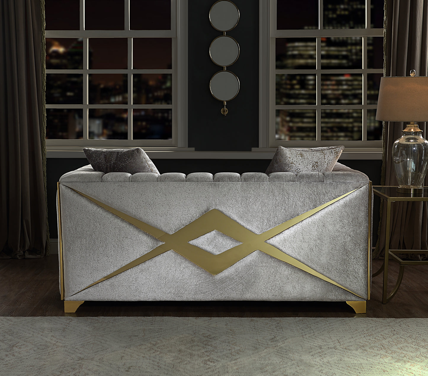 Glamorous silver velvet ottoman with gold geometric accents perfect for a luxurious living room