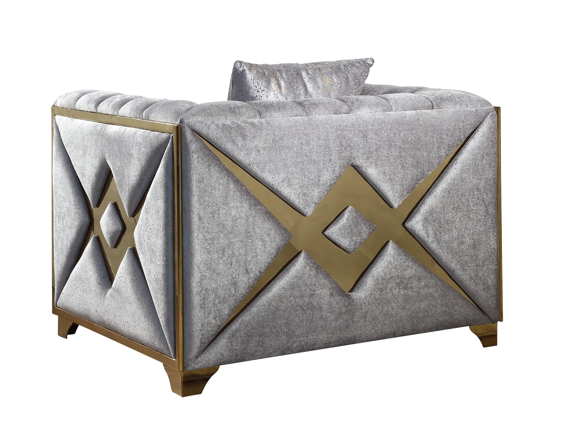 Grey velvet armchair with gold geometric accents and plush cushioning