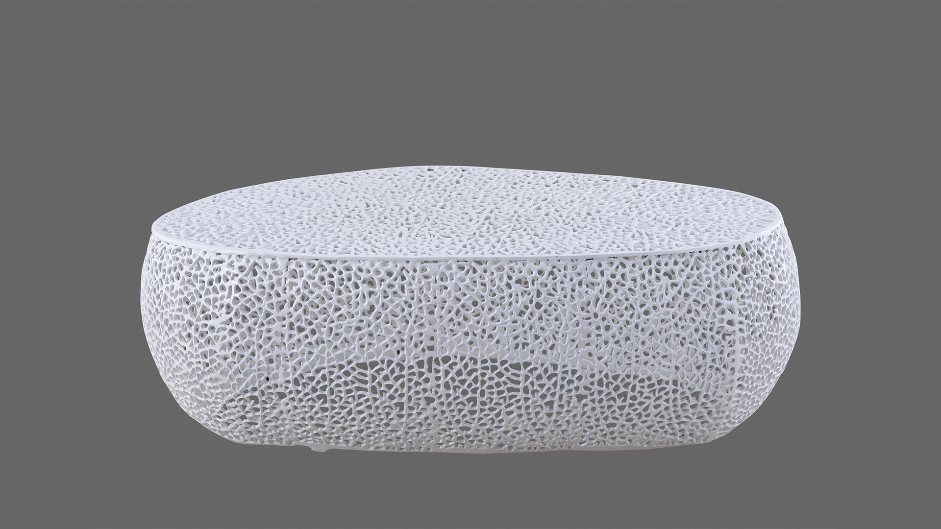 White modern coffee table with intricate cutout design