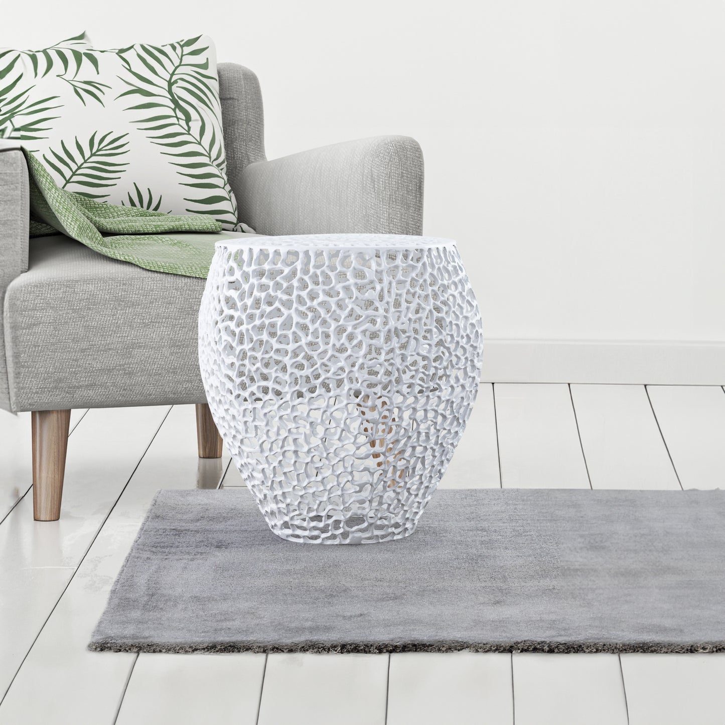White ornate carved accent table with a textured pattern perfect for living room decor