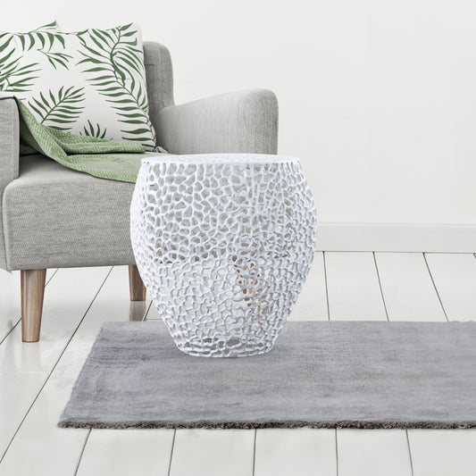 White ornate carved accent table with a textured pattern perfect for living room decor