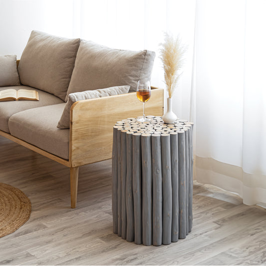Gray wood log accent table with a rustic natural design for living rooms