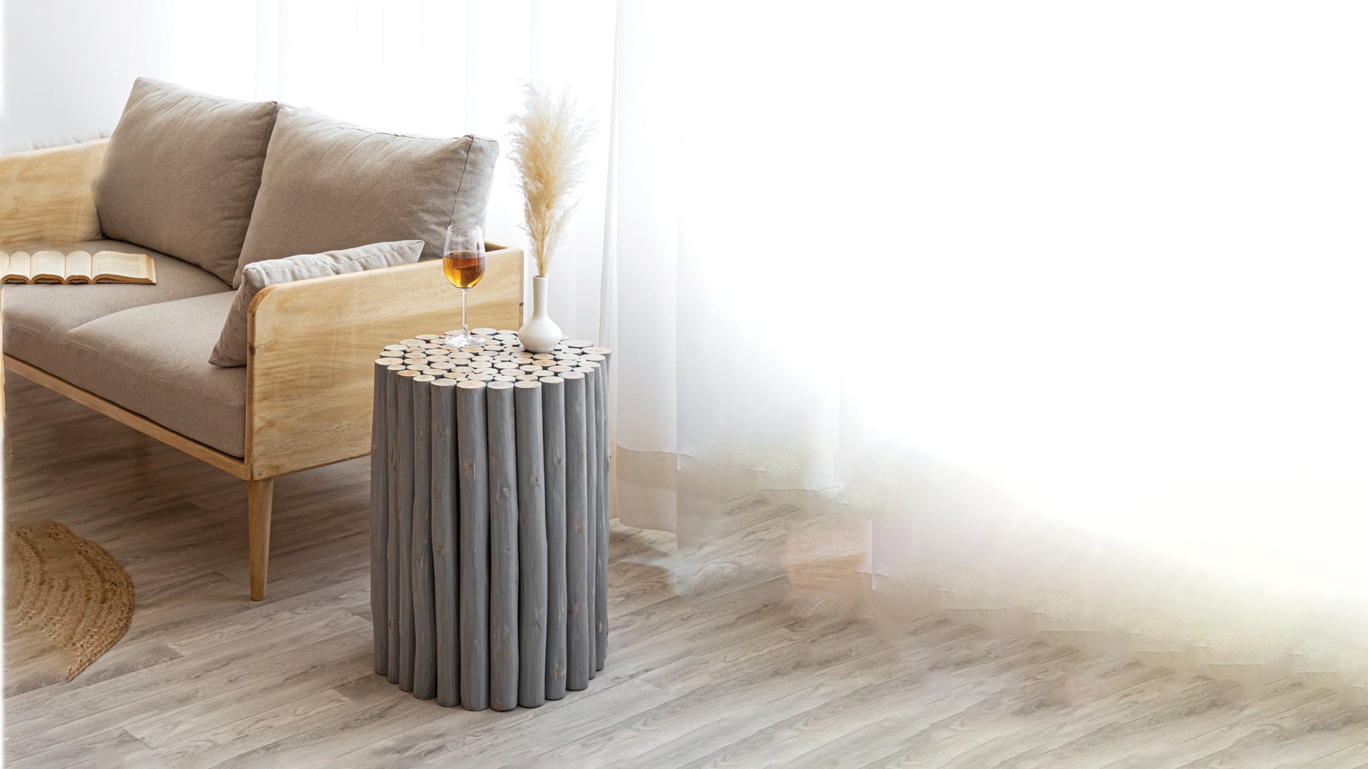 Rustic grey log accent table with a round top perfect for small spaces