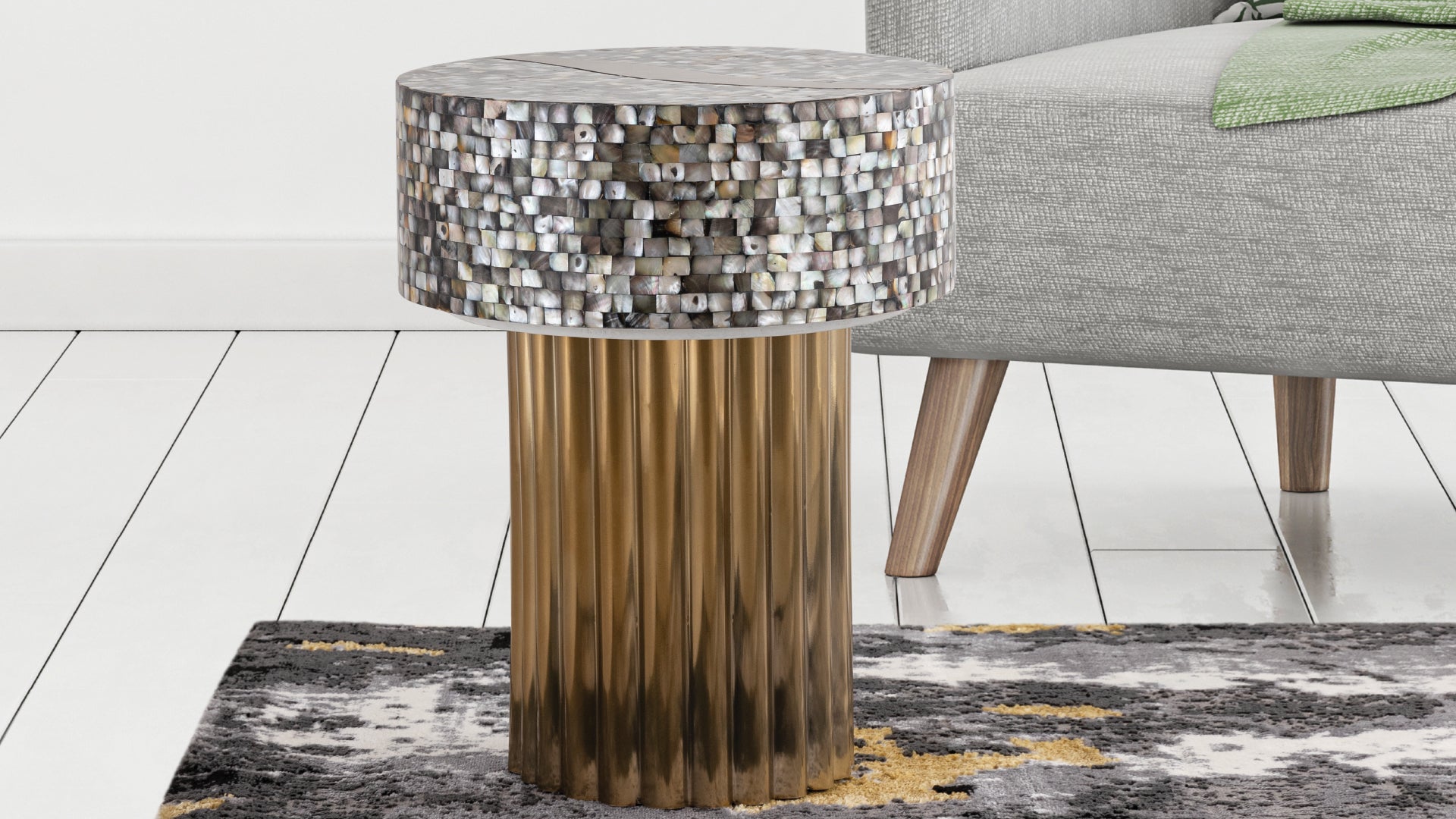 Round accent table with mother of pearl inlay top and fluted gold pedestal base