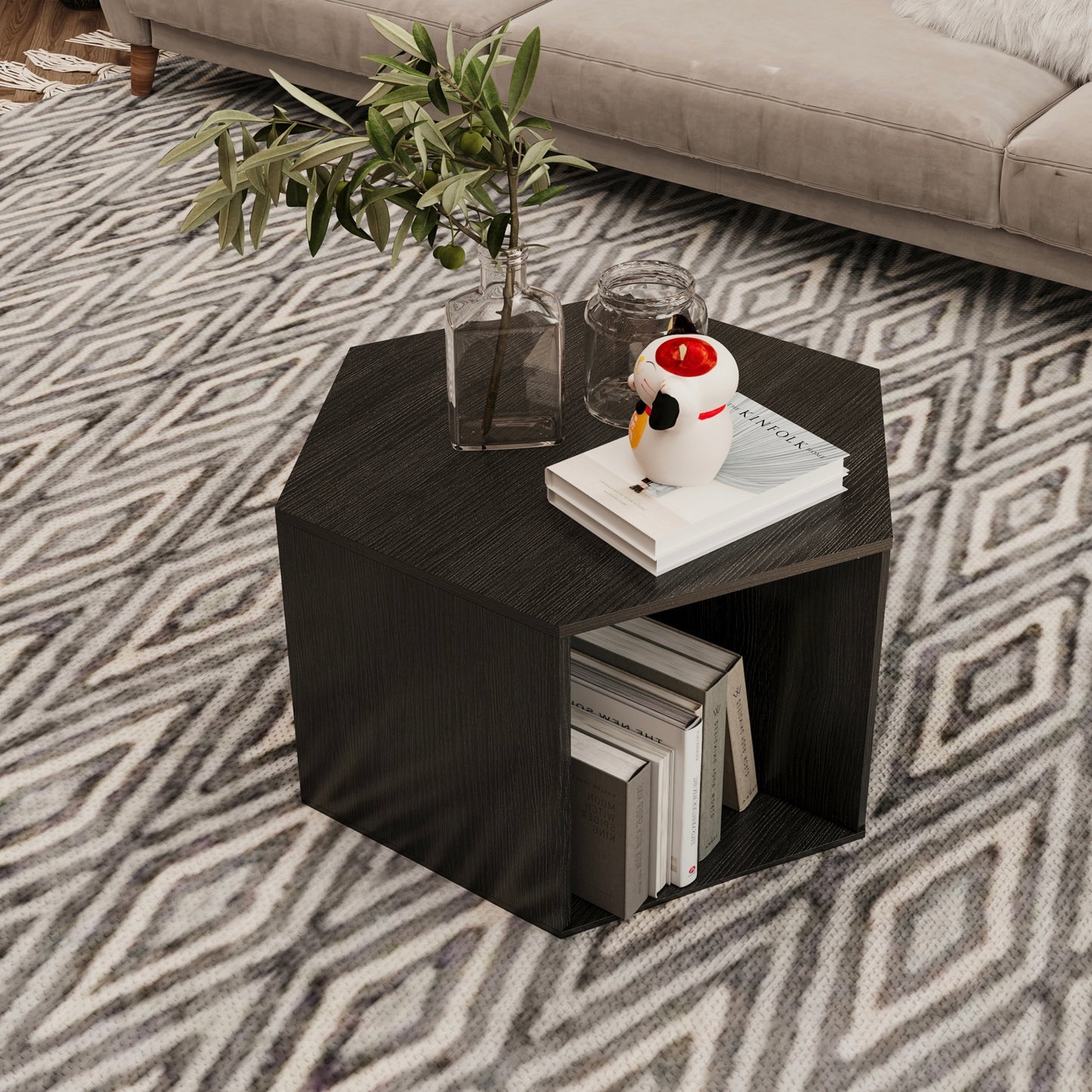 Dark wood hexagonal end table with open shelving holding books